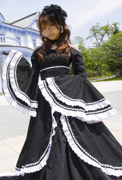 
Reina Tanaka is wearing a nice dress.
 